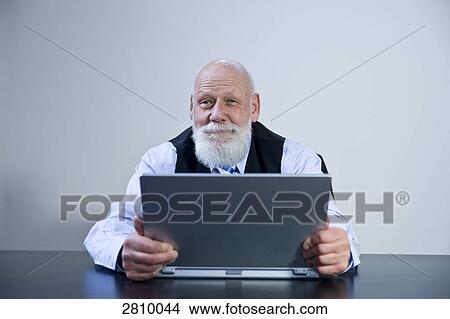 Businessman using laptop View Large Photo Image Picture - Businessman using laptop . Fotosearch
