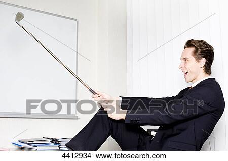 Businessman with golf club View Large Photo Image Picture - Businessman with golf club . Fotosearch