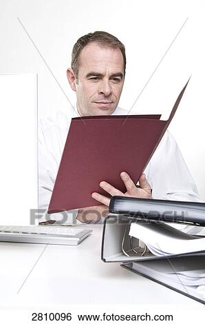Stock Photograph - Businessman working in office . Fotosearch