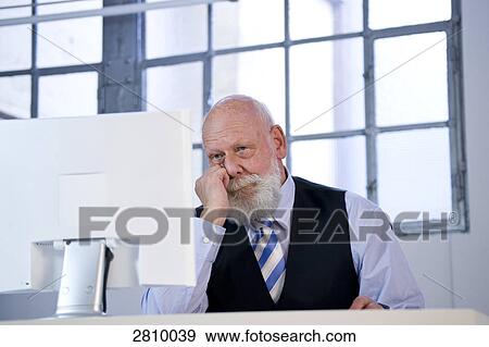 Businessman working on computer View Large Photo Image Stock Photo - Businessman working on computer . Fotosearch