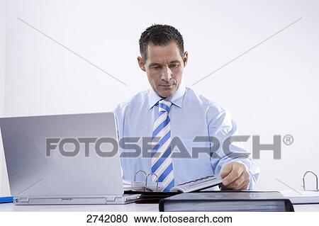 Businessman working on laptop View Large Photo Image Stock Image - Businessman working on laptop . Fotosearch
