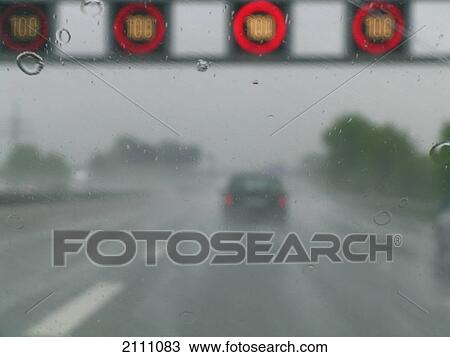 Car on wet road View Large Photo Image Stock Image - Car on wet road . Fotosearch