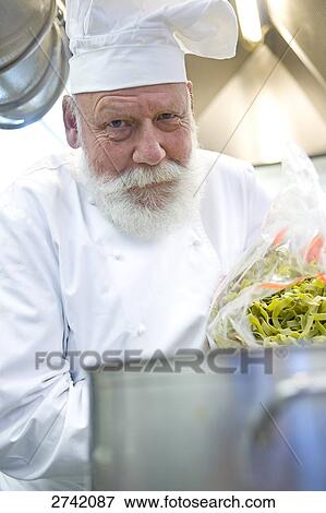 Chef cooking food View Large Photo Image Stock Photo - Chef cooking food . Fotosearch