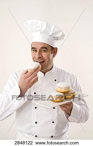 Chef eating pie View Large Photo Image Stock Image - Chef eating pie . Fotosearch