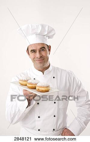 Chef holding pies View Large Photo Image Stock Image - Chef holding pies . Fotosearch