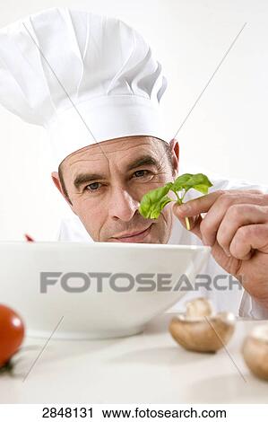 Chef preparing food View Large Photo Image Stock Image - Chef preparing food . Fotosearch