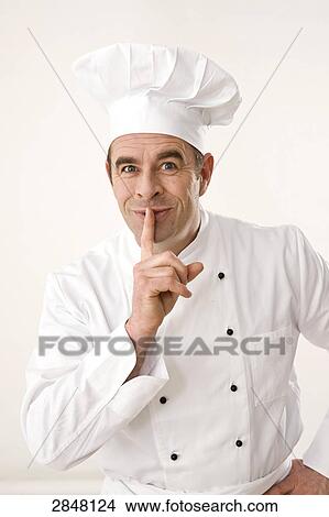 Chef with his finger on lips View Large Photo Image Picture - Chef with his finger on lips . Fotosearch