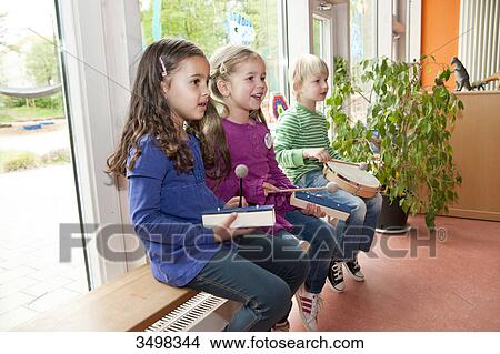 Picture - Children making music in a kindergarten . Fotosearch
