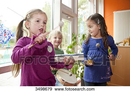 Children making music in a kindergarten View Large Photo Image Stock Photo - Children making music in a kindergarten . Fotosearch