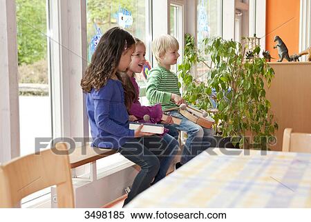 Stock Photography - Children making music in a kindergarten . Fotosearch