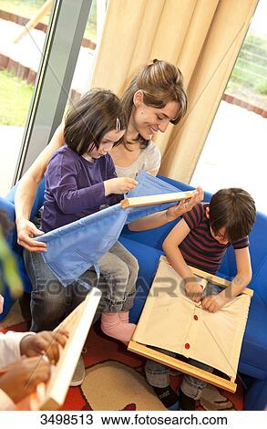 Children playing with fasteners frames View Large Photo Image Stock Image - Children playing with fasteners frames . Fotosearch