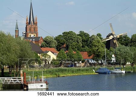Church and houses in town View Large Photo Image Stock Image - Church and houses in town . Fotosearch