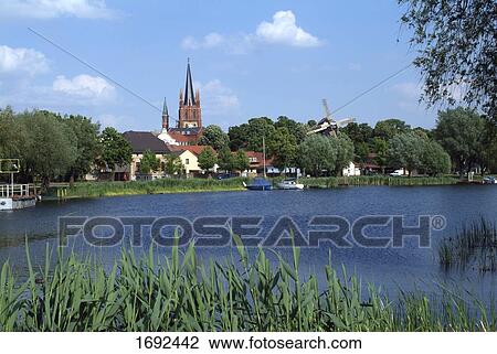 Church and houses in town View Large Photo Image Stock Image - Church and houses in town . Fotosearch