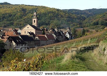 Church and houses in town View Large Photo Image Stock Photo - Church and houses in town . Fotosearch