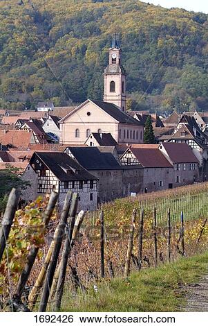 Stock Photograph - Church and houses in town . Fotosearch