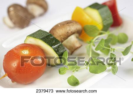 Stock Image - Close-up of assorted vegetables on plate . Fotosearch