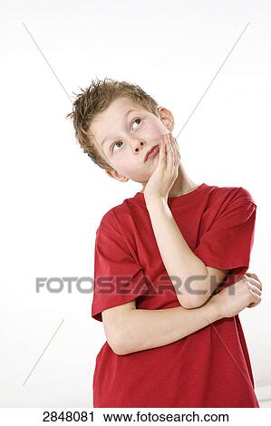 Stock Image - Close-up of boy thinking . Fotosearch