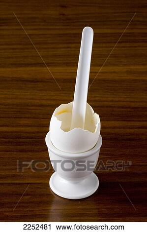 Close-up of broken egg in eggcup View Large Photo Image Stock Image - Close-up of broken egg in eggcup . Fotosearch