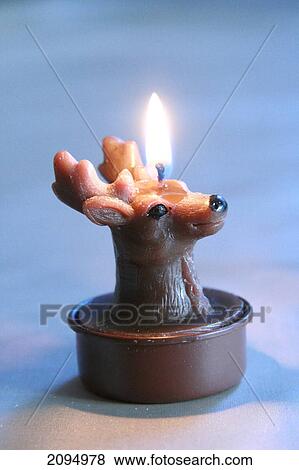 Close-up of burning Christmas candle View Large Photo Image Stock Photo - Close-up of burning Christmas candle . Fotosearch