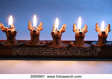 Close-up of burning Christmas candles View Large Photo Image Stock Image - Close-up of burning Christmas candles . Fotosearch
