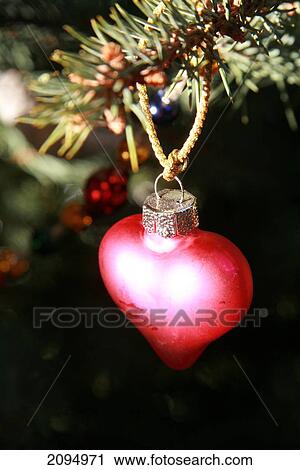 Close-up of Christmas ornament hanging on tree View Large Photo Image Stock Image - Close-up of Christmas ornament hanging on tree . Fotosearch