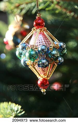 Close-up of Christmas ornament hanging on tree View Large Photo Image Stock Image - Close-up of Christmas ornament hanging on tree . Fotosearch