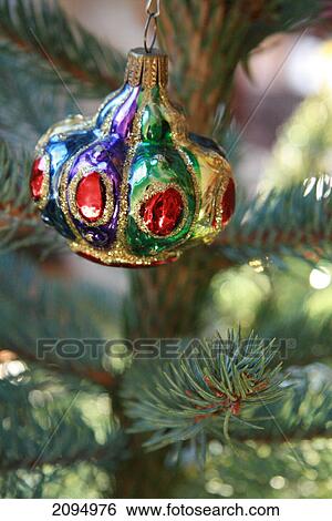 Close-up of Christmas ornament hanging on tree View Large Photo Image Stock Photograph - Close-up of Christmas ornament hanging on tree . Fotosearch