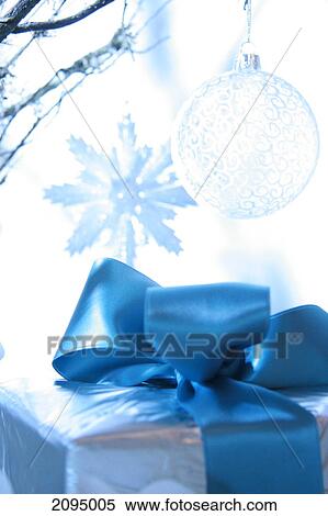 Stock Photography - Close-up of Christmas ornament with gift box . Fotosearch