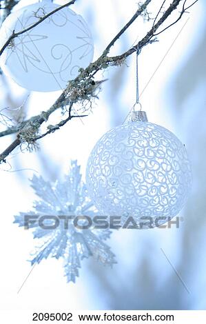 Close-up of Christmas ornaments hanging on tree View Large Photo Image Stock Image - Close-up of Christmas ornaments hanging on tree . Fotosearch