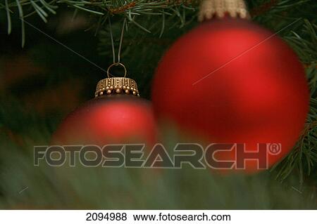 Close-up of Christmas ornaments hanging on tree View Large Photo Image Stock Photo - Close-up of Christmas ornaments hanging on tree . Fotosearch