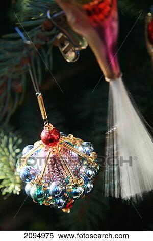 Close-up of Christmas ornaments hanging on tree View Large Photo Image Stock Photography - Close-up of Christmas ornaments hanging on tree . Fotosearch