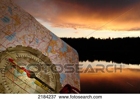 Stock Photo - Close-up of compass and map . Fotosearch