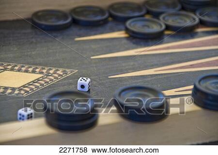 Stock Photo - Close-up of dices on carrom board . Fotosearch