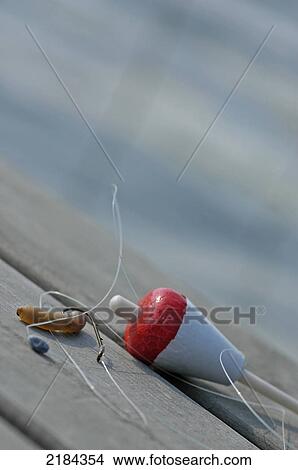 Close-up of fishing equipment on wooden plank View Large Photo Image Picture - Close-up of fishing equipment on wooden plank . Fotosearch