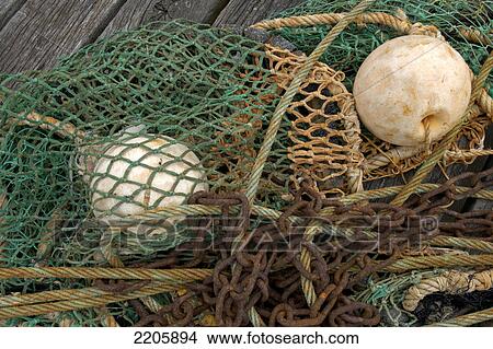 Picture - Close-up of fishing net with chain . Fotosearch