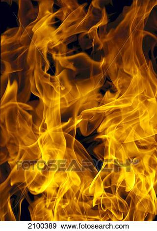 Stock Photo - Close-up of flame against black background . Fotosearch