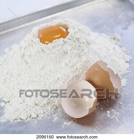 Close-up of flour with egg yolk View Large Photo Image Stock Image - Close-up of flour with egg yolk . Fotosearch