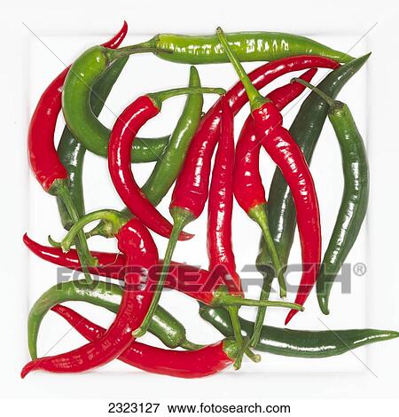 Close-up of green and red chilies View Large Photo Image Stock Photo - Close-up of green and red chilies . Fotosearch