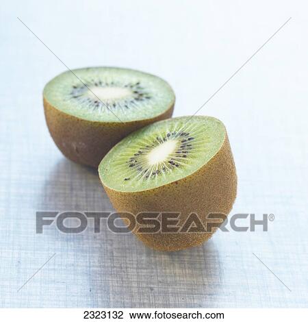 Stock Image - Close-up of halves of kiwi fruits . Fotosearch