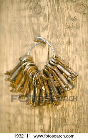 Close-up of key ring hanging on wood View Large Photo Image Stock Image - Close-up of key ring hanging on wood . Fotosearch