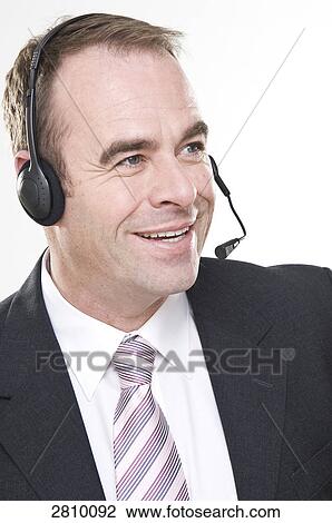 Stock Image - Close-up of male customer care representative . Fotosearch