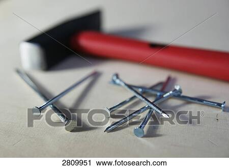 Close-up of nails with hammer View Large Photo Image Stock Image - Close-up of nails with hammer . Fotosearch