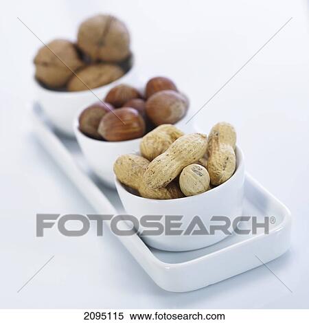 Close-up of nuts in bowls View Large Photo Image Stock Photography - Close-up of nuts in bowls . Fotosearch