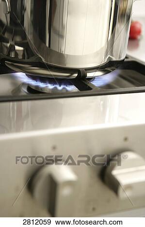 Close-up of pan on stove View Large Photo Image Stock Photo - Close-up of pan on stove . Fotosearch