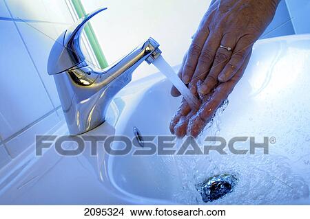 Picture - Close-up of person washing hands . Fotosearch