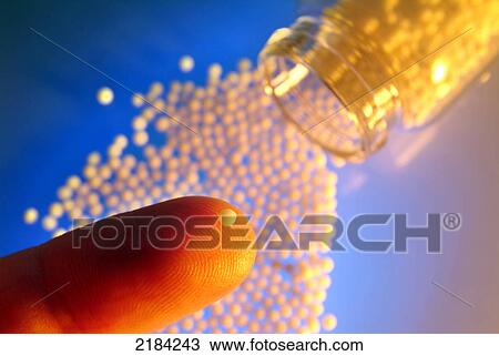 Close-up of pill on finger View Large Photo Image Stock Image - Close-up of pill on finger . Fotosearch