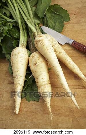 Stock Photo - Close-up of radishes with knife . Fotosearch