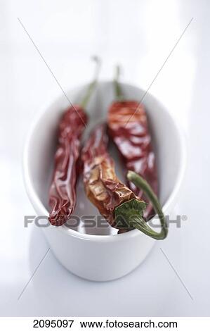Close-up of red chili peppers in cup View Large Photo Image Stock Photo - Close-up of red chili peppers in cup . Fotosearch