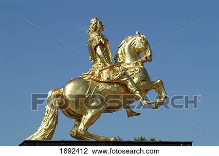 Stock Image - Close-up of statue of horserider against sky . Fotosearch
