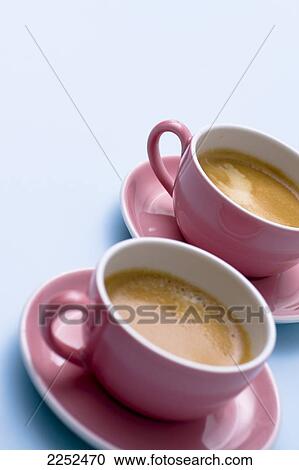 Close-up of two cups of tea on saucers View Large Photo Image Stock Image - Close-up of two cups of tea on saucers . Fotosearch